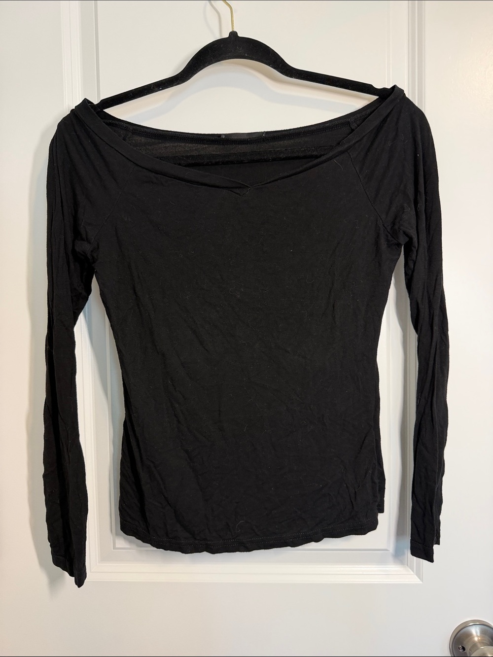 Woman’s Black Long-Sleeve off the shoulder Tee